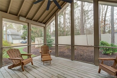 Unfurnished sunroom featuring vaulted ceiling with