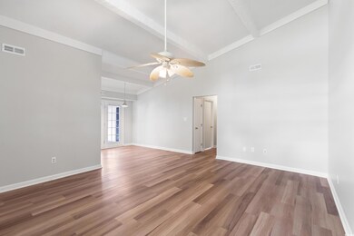 Living Room with a ceiling fan, LVT floors, basebo