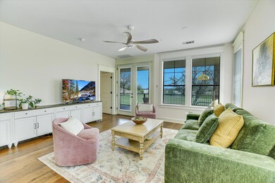 Living area featuring wood finished floors and ce