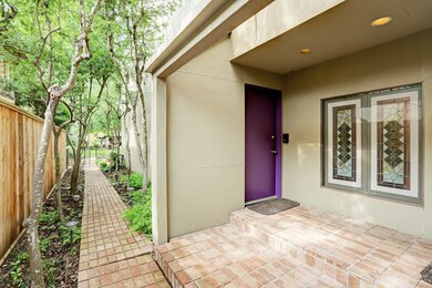 A brick pathway leads to the unassuming entrance o