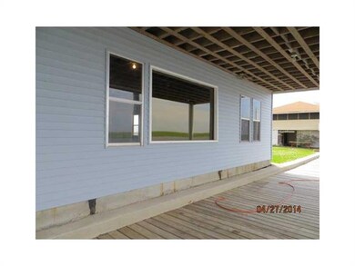 Exterior Back. DOWNSTAIRS COVERED DECKING OVER ZEE