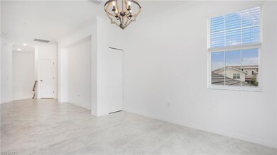 Unfurnished room with a chandelier and ornamental molding