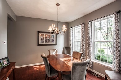 Neutral paint and new wood floors in dining room and main level
