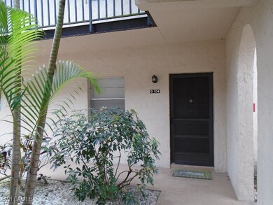 View of exterior entry with a balcony