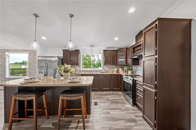 Kitchen with stainless steel appliances, under cab