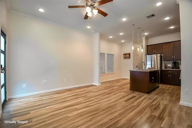 This open-concept space features a modern kitchen