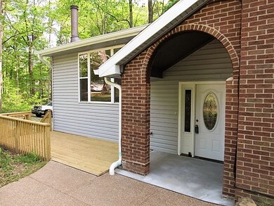 Covered front porch and gorgeous front door welcom