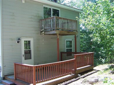 Private back deck with balcony on...