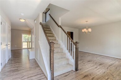 Gorgeous Trim on Stair Case Greets You in Foyer an