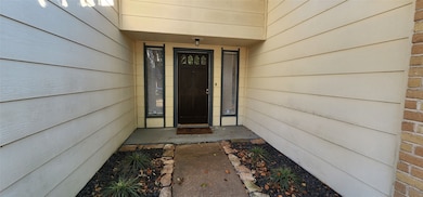 Welcoming front entrance with stone pathway leadin