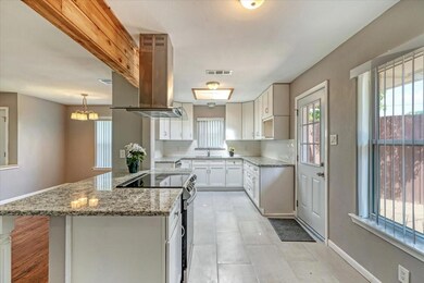Kitchen featuring stainless steel range with elect