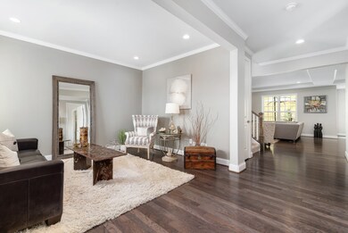 Just off the Entry is the Living Room with crown molding which could be used as a Den or Formal Dining Room