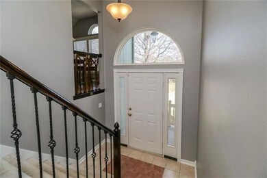 Beautiful entry with iron spindles.