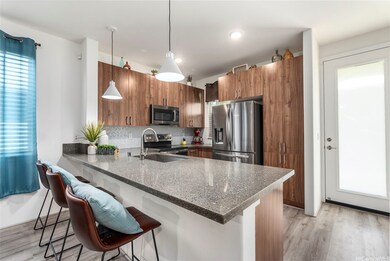 Modern kitchen with quartz countertops, wood-grain