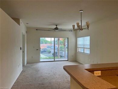 Unfurnished living room featuring ceiling fan with