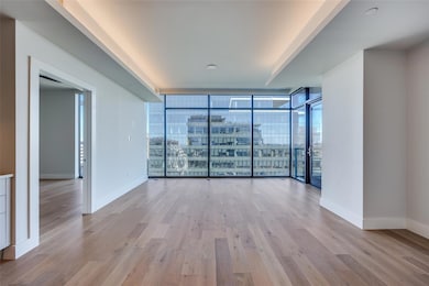 Empty room with floor to ceiling windows and light