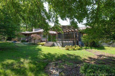 House situated on large corner lot with mature tre