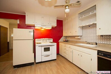 Charming Kitchen with laminate flooring and ample
