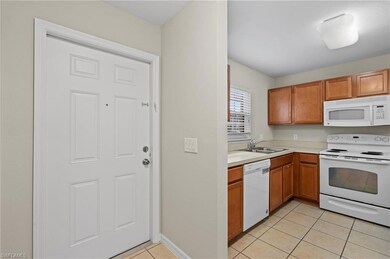 Front door entryway and kitchen of a townhome, fea