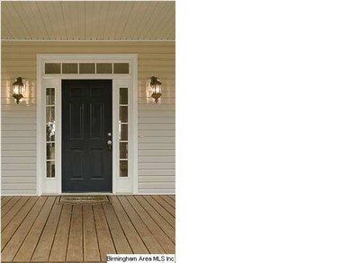 COVERED FRONT PORCH AT ENTRANCE