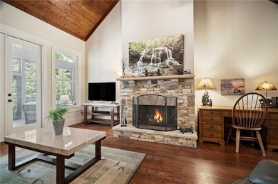 Living area featuring open floor plan with high va