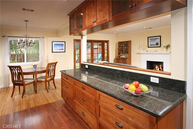 The dining room with its drop down chandelier and gleaming hardwood floors fittingly adjoins the kitchen making it easy to serve and entertain your guests simultaneously.