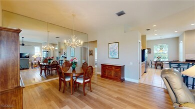 Dining space with a chandelier, light wood finished floors, recessed lighting, and plenty of natural light