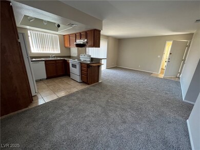 Kitchen featuring white appliances, under cabinet
