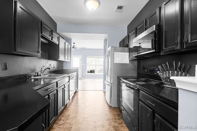 Kitchen with electric range, stainless steel micro