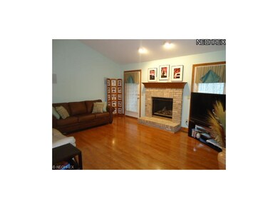 The living room has newer flooring and is freshly 