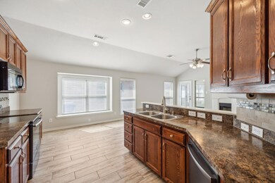 Kitchen with appliances with stainless steel finis