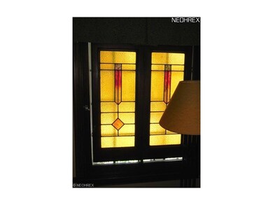 Stained glass insets remain with the house.