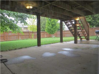 This is the view of the backyard. Nice covered pat