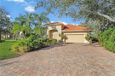 Mediterranean / spanish-style house with a garage