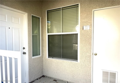 View of exterior entry with stucco siding