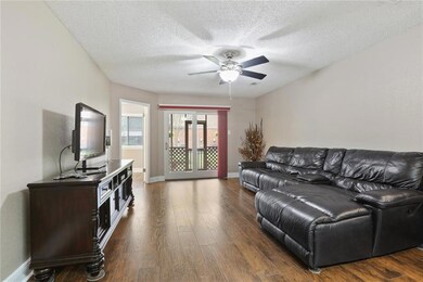 Nice size living room with laminate wood floors! N