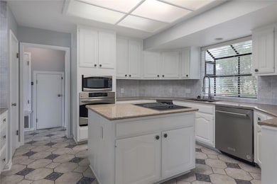 Kitchen featuring stainless steel appliances, a c