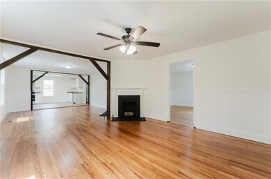 Unfurnished living room with wood-type flooring an