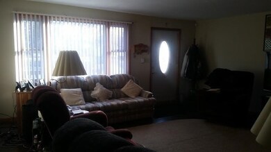 Living room with view to front door.