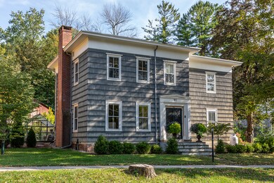 The front yard is peppered with Boxwood and Juniper, a Dogwood and Crab Apple tree.