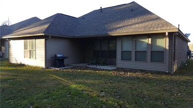 Rear of home with covered patio.