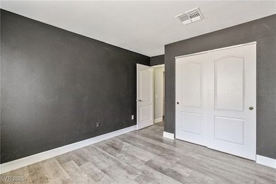 Unfurnished bedroom featuring wood finished floors