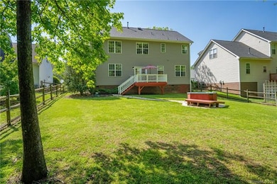 Large fenced backyard with recently refinished dec