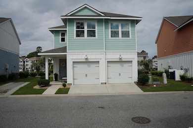 View of house front featuring a two car garage