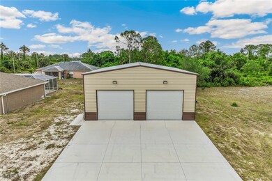 Detached, Insulated garage with two 10' Tall, 12'