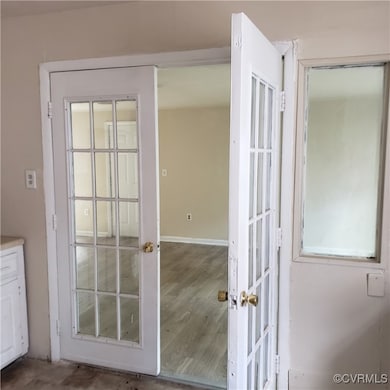 Doorway to outside with french doors and wood-type