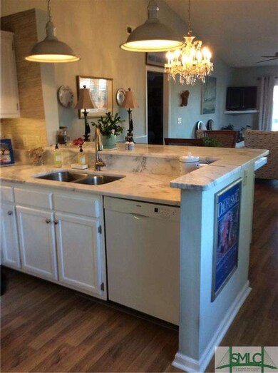 open floor plan with new granite that overlooks Bu