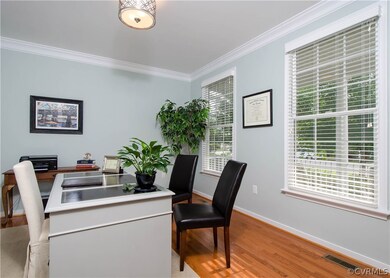 The living room, currently used as an office, has
