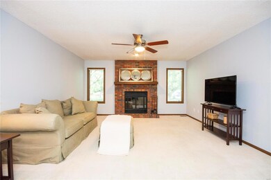 Large family room w/wood fireplace, brick hearth a