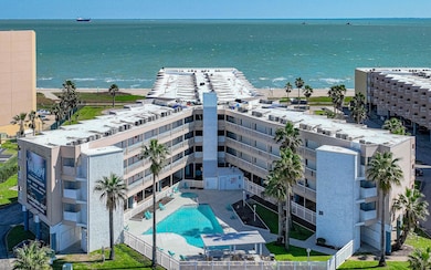 Aerial view of a large body of water, a pool, and